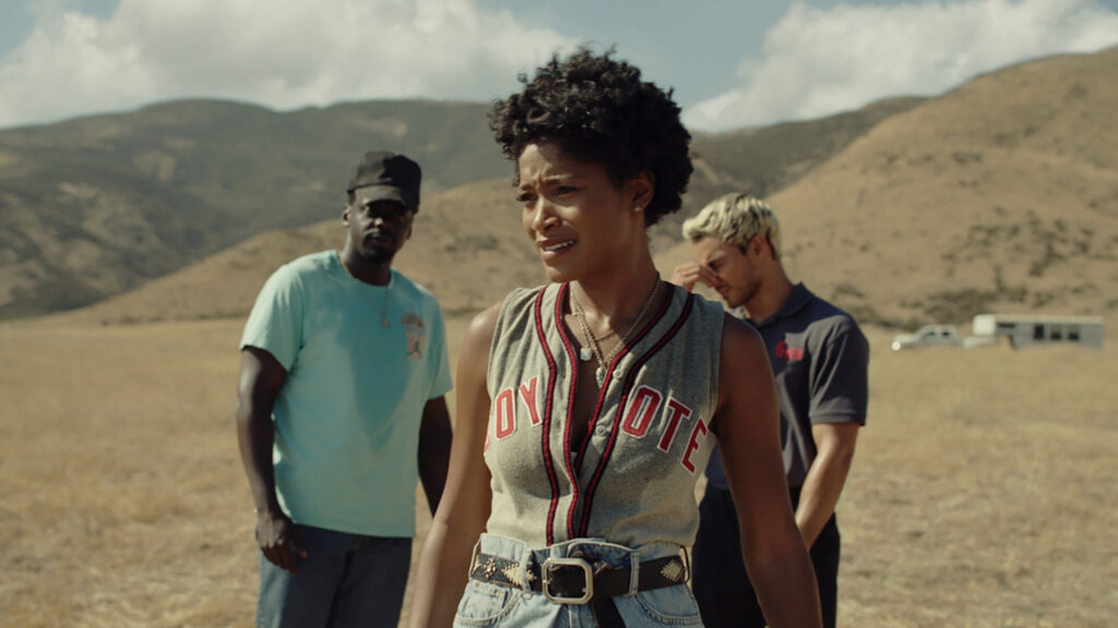 Keke Palmer, Daniel Kaluya, and Daniel Perea look off in the desert in NOPE