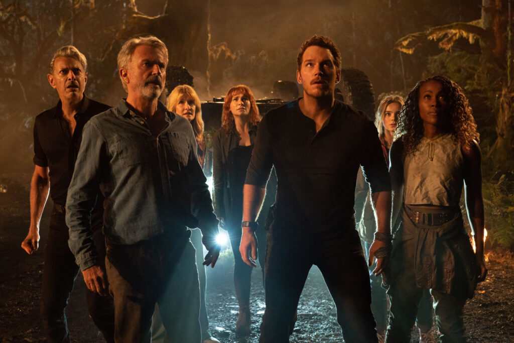 (from left to right) Dr. Ian Malcolm (Jeff Goldblum), Dr. Alan Grant (Sam Neill), Dr. Ellie Sattler (Laura Dern), Claire Dearing (Bryce Dallas Howard), Owen Grady (Chris Pratt), Maisie Lockwood (Isabella Sermon) and Kayla Watts (DeWanda Wise) in Jurassic World Dominion