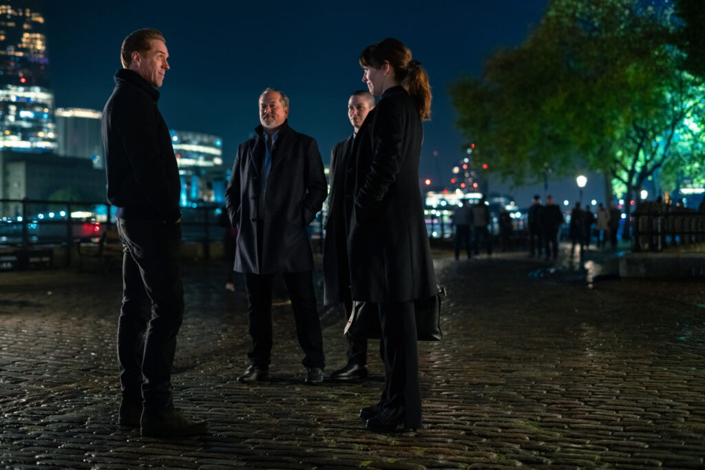 (L-R): Damian Lewis as Bobby "Axe" Axelrod, David Costabile as Mike ‘Wags’ Wagner, Asia Kate Dillon as Taylor Mason and Maggie Siff as Wendy Rhoades in BILLIONS Season 7. Photo Credit: Laurence Cendrowicz/SHOWTIME.